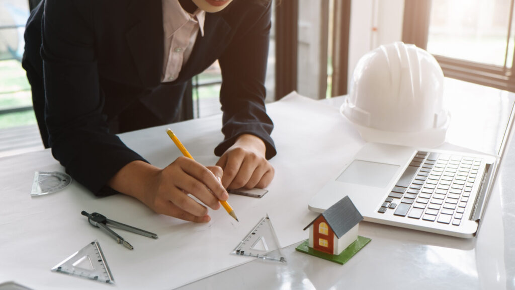 architect is planning with construction management software aside
