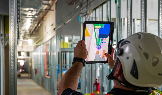 image of a person using the app on a construction site